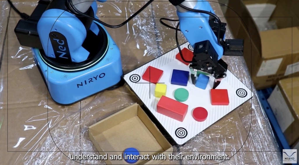 A collaborative robot moving pieces thanks to its camera