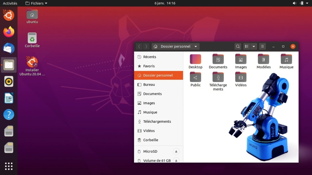 A blue desktop robot in front of an Ubuntu screen